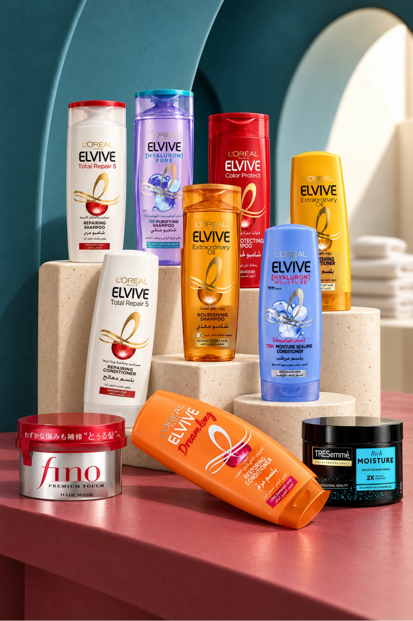 L'Oréal Elvive shampoos and conditioners on stone plinths, with Fino and TRESemmé hair masks